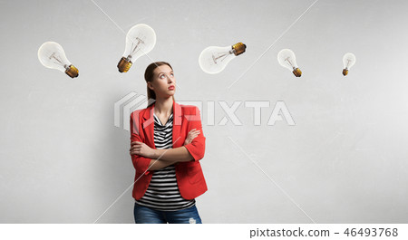 Girl in red jacket with arms crossed Girl in red jacket with arms crossed 46493768