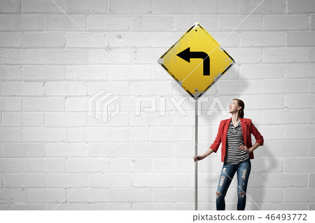 Pretty girl with roadsign Pretty girl with roadsign 46493772