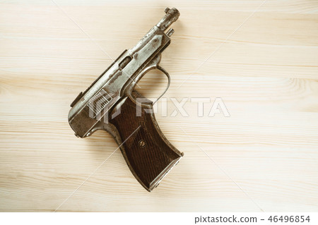 the gun is on the table the gun is on the table 46496854