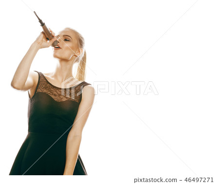 young pretty blond woman singing in microphone isolated close up 46497271