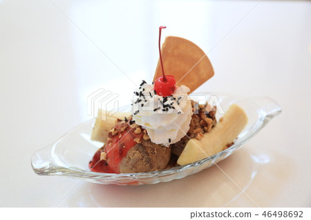 Ice cream with banana red cherry and cracker 46498692