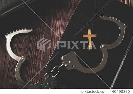 Simple Wood Cross and Unchain Handcuffs. Simple Wood Cross and Unchain Handcuffs. 46498850