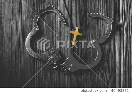 Simple Wood Cross and Unchain Handcuffs. 46498851