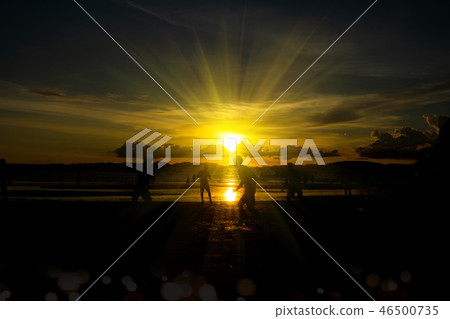 Back Light sunset silhouettes of football player 46500735