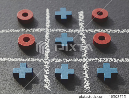 Tic tac toe game on dark slate background. 46502735