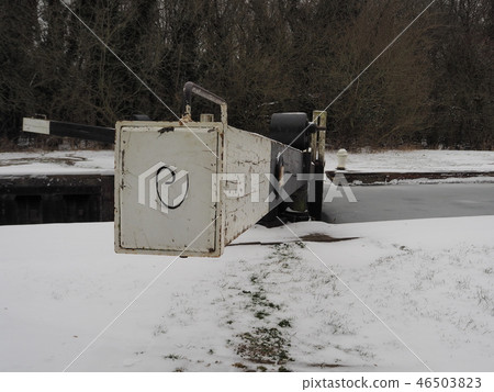 Lock gate in winter with snow on the ground and ice on the water, Kennet and Avon Canal Lock gate in winter with snow on the ground and ice on the water, Kennet and Avon Canal 46503823