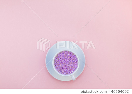 Cup of beautiful lilac flowers infused water 46504092