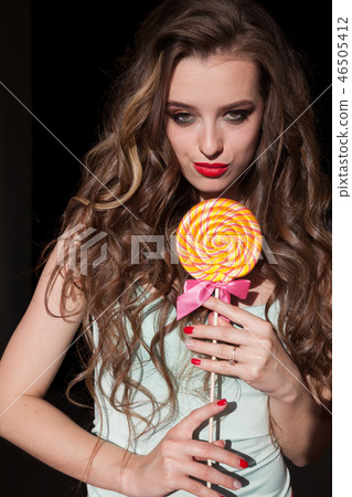 beautiful woman eats sweet candy lollipop sweets tasty beautiful woman eats sweet candy lollipop sweets tasty 46505412