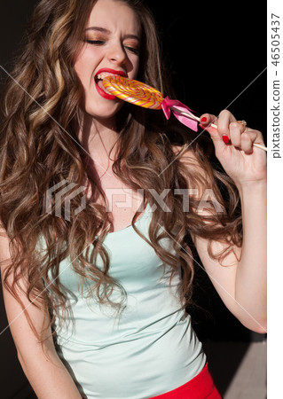 beautiful woman eats sweet candy lollipop sweets tasty beautiful woman eats sweet candy lollipop sweets tasty 46505437