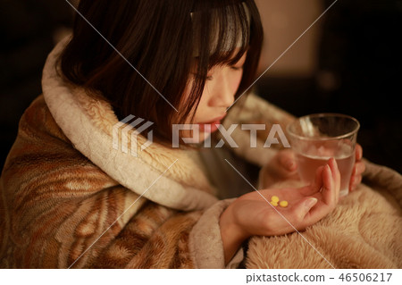 Woman taking medicine 46506217