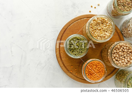 Assorted dry legumes and pulses in glass jars 46506505