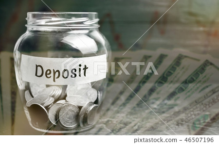 Glass jar with coins and the inscription Glass jar with coins and the inscription 46507196