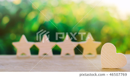 four stars and heart on a green bokeh background 46507769