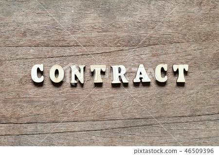 Letter block in word contract on wood background Letter block in word contract on wood background 46509396