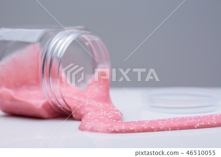 Mucus in the bank. Slime flows from the jar. Mucus in the bank. Slime flows from the jar. 46510055