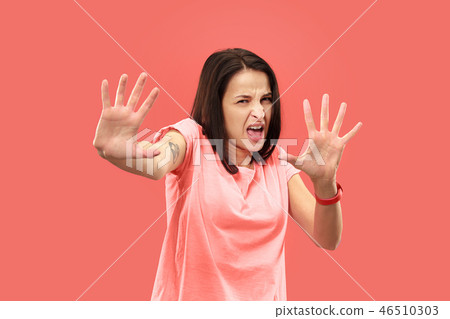 Let me think. Doubtful pensive woman with thoughtful expression making choice against coral 46510303