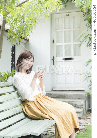 Woman using a smartphone Woman using a smartphone 46510554