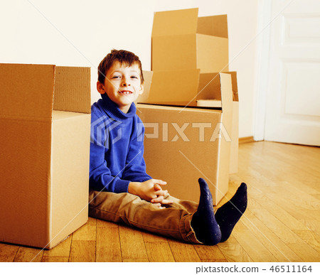 little cute boy in empty room, move to new house. home alone amo 46511164