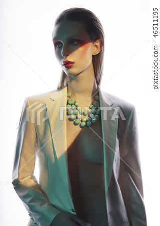 Sexy lady in colorful neacklace and white jacket 46511195