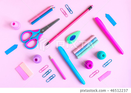 Pink desk with variety of school supplies Pink desk with variety of school supplies 46512237