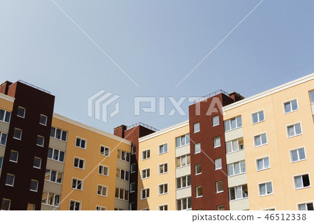 Facade of a multi-storey building. Fragment. 46512338