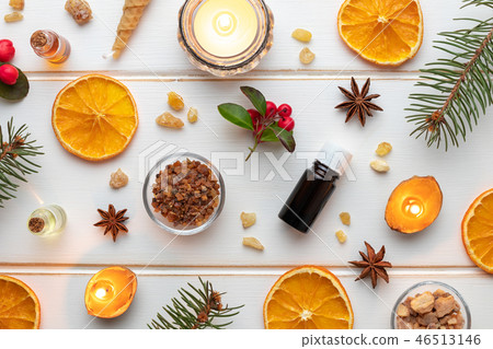 Christmas background with essential oil bottles Christmas background with essential oil bottles 46513146