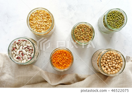 Assorted dried legumes and pulses in jars 46522075