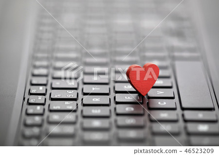 Small red heart on keyboard 46523209