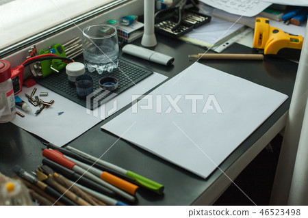 Painter workplace in order side view. Designer Painter workplace in order side view. Designer 46523498
