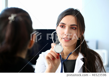 Portrait beautiful smiling female doctor hold Portrait beautiful smiling female doctor hold 46523596