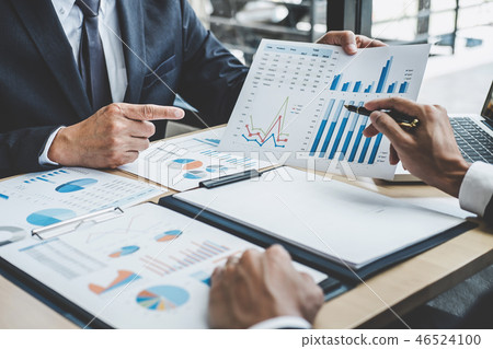 Two executive discussing company growth project success financia Two executive discussing company growth project success financia 46524100