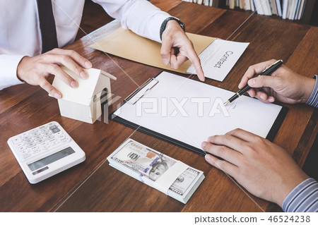 Business Signing a Contract Buy - sell house, Man sign a home in Business Signing a Contract Buy - sell house, Man sign a home in 46524238