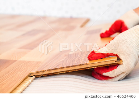 Installation of wooden floorboard 46524406