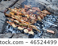 Cooking kebabs in the field 46524499