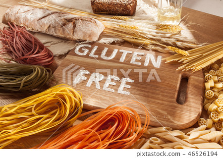Gluten free food. Various pasta, bread and snacks on wooden background from top view 46526194