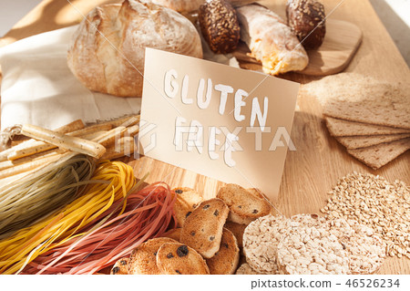 Gluten free food. Various pasta, bread and snacks on wooden background from top view 46526234