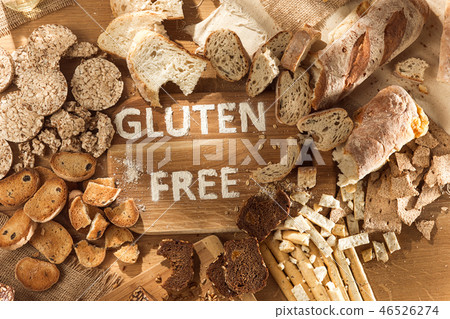 Gluten free food. Various pasta, bread and snacks on wooden background from top view Gluten free food. Various pasta, bread and snacks on wooden background from top view 46526274