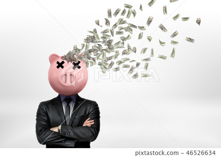 Businessman with piggy bank head and money dollars flying out of head on white background 46526634