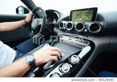 hand on automatic gear shift, Man hand shifting an automatic car hand on automatic gear shift, Man hand shifting an automatic car 46529093