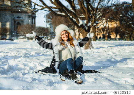 Nice winter girl having fun outdoor 46530513