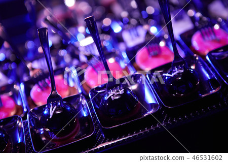 Beautifully decorated catering banquet table with different food snacks. Beautifully decorated catering banquet table with different food snacks. 46531602