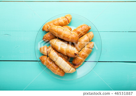 a plate of sausages in dough, homemade pastries 46531887