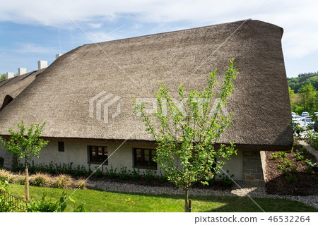 Traditional thatched roof from reed, sunny summer Traditional thatched roof from reed, sunny summer 46532264