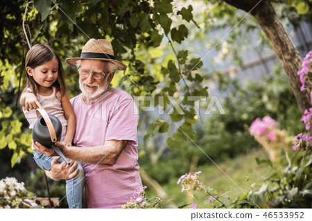 Grandparent with his grandchild spending time together in countryside Grandparent with his grandchild spending time together in countryside 46533952