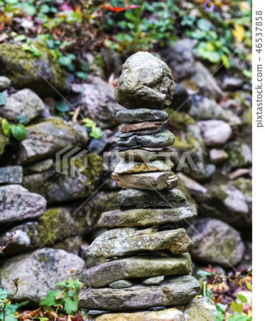 The stone pagoda which is a local faith accumulated at the entrance of the rural village 46537858