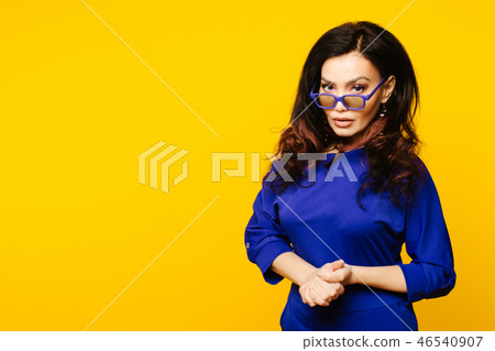 serious business woman in glasses on background serious business woman in glasses on background 46540907