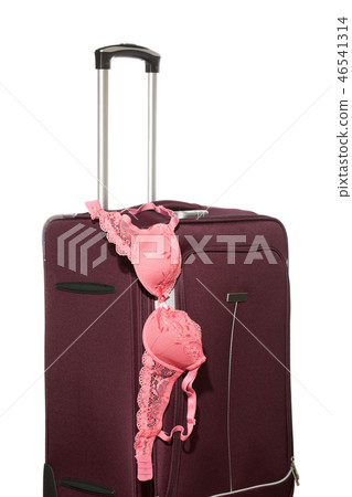 Travel suitcase with pull-out handle an female bra 46541314