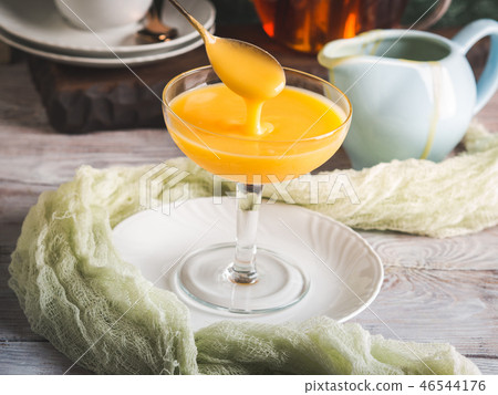 Lemon curd served in stemmed glass 46544176