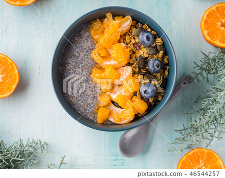 Chia pudding with tangerines and granola Chia pudding with tangerines and granola 46544257