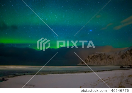 Aurora Borealis over the Winter Norwegian Beach 46546776